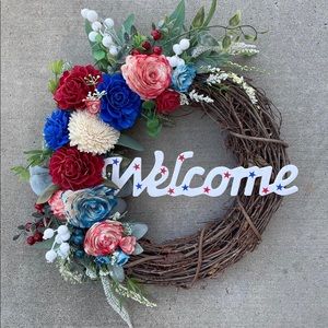 16” wreath. Red, white & blue sola wood flowers. Welcome and Bow included